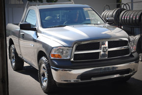 Ram truck service with tires on rack
